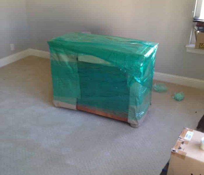 Dresser shrink wrapped and paper padded for an international move.